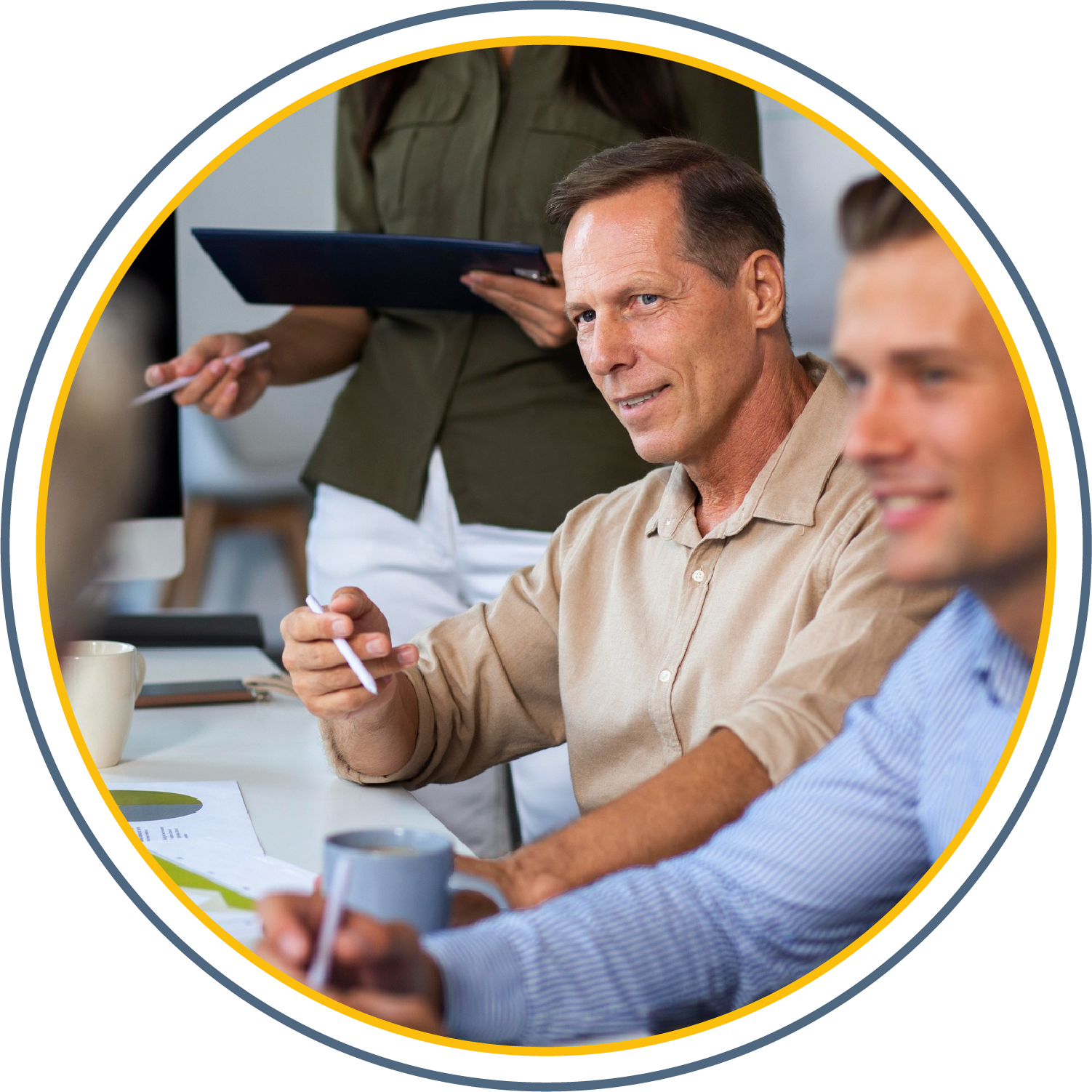 an Imagine for a Man holding a pencil speaking in a meeting